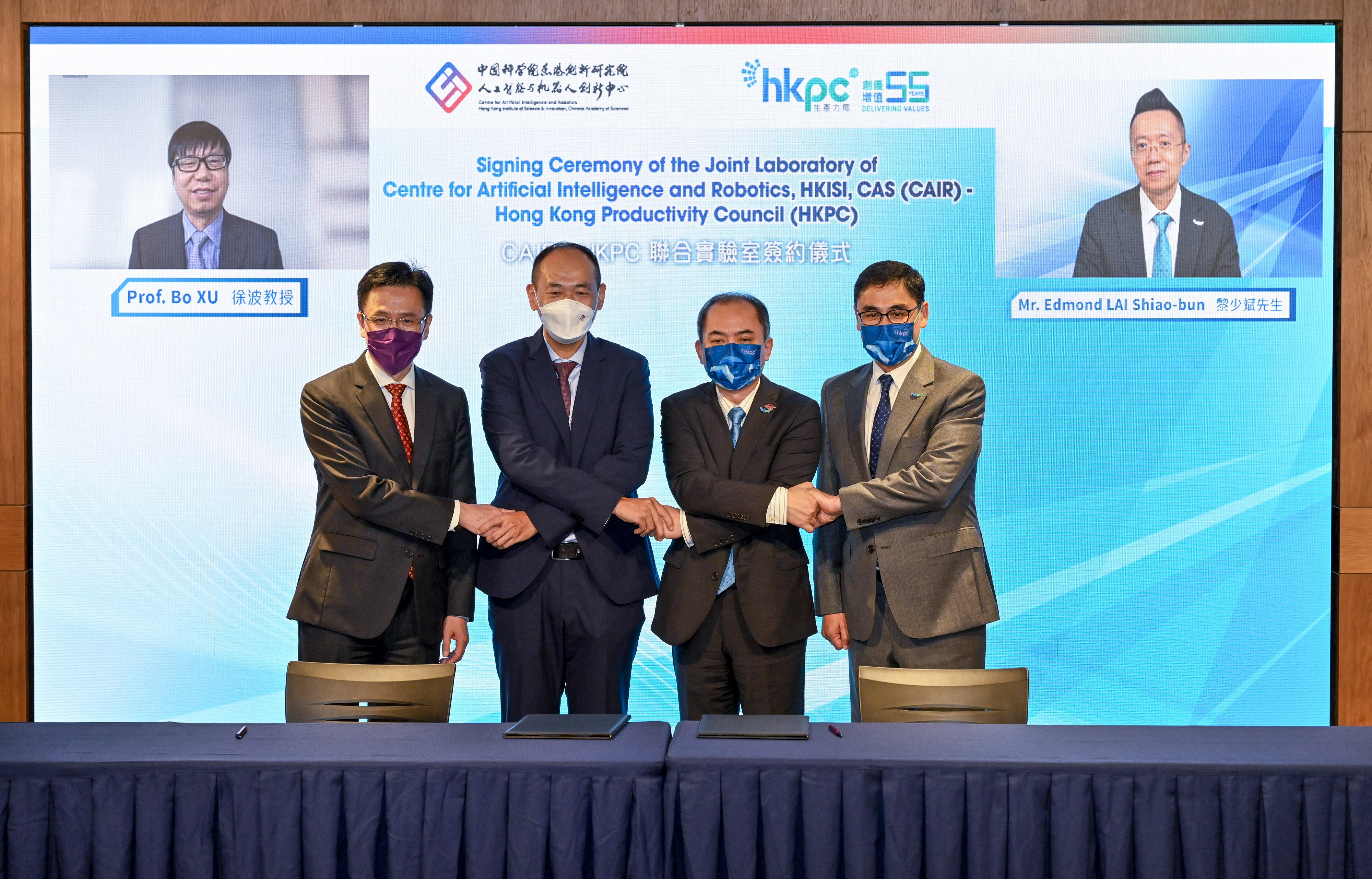(From left) Dr Bo XU, Director of CAIR and President of Institute of Automation, Chinese Academy of Sciences; Prof. Dong SUN, Secretary for Innovation, Technology and Industry, HKSAR Government; Dr Hongbin LIU, Executive Director of CAIR; Dr Ming GE, General Manager of Robotics and Artificial Intelligence Division of HKPC, Mr Mohamed BUTT, Executive Director of HKPC and Mr Edmond LAI, Chief Digital Officer of HKPC, take a group photo to commemorate the establishment of the CAIR-HKPC Joint Lab.